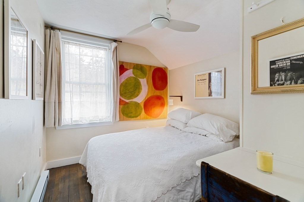 27 White Place Brookline, MA 02445 - Photo 12 of 17 a bedroom with a bed and a window