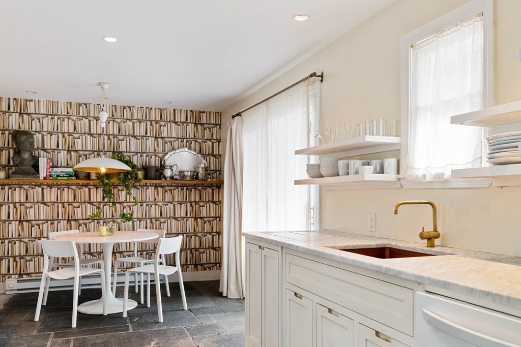 27 White Place Brookline, MA 02445 - Photo 7 of 17 a kitchen with stainless steel appliances a sink and cabinets