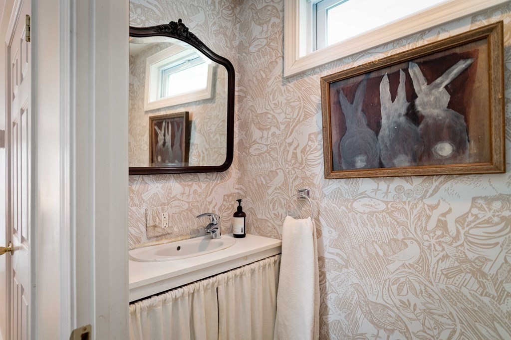 27 White Place Brookline, MA 02445 - Photo 9 of 17 a bathroom with a sink and a mirror