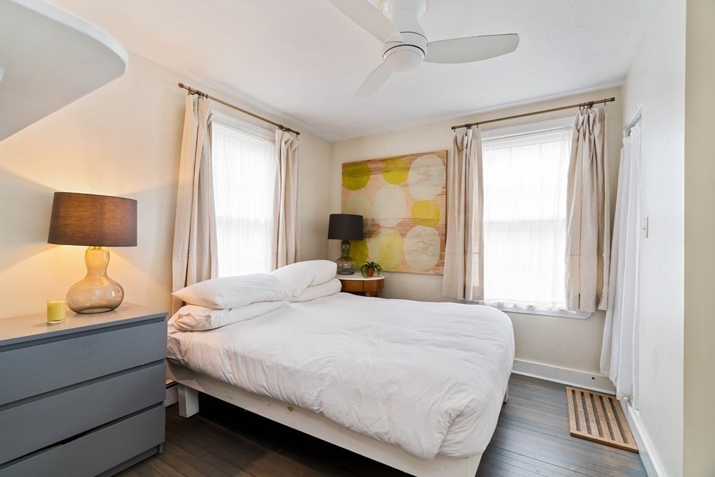 27 White Place Brookline, MA 02445 - Photo 10 of 17 a bedroom with a bed and wooden floor