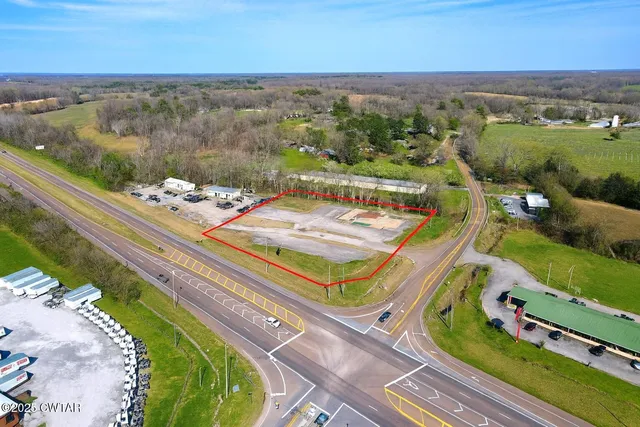 an aerial view of a house with a ocean view