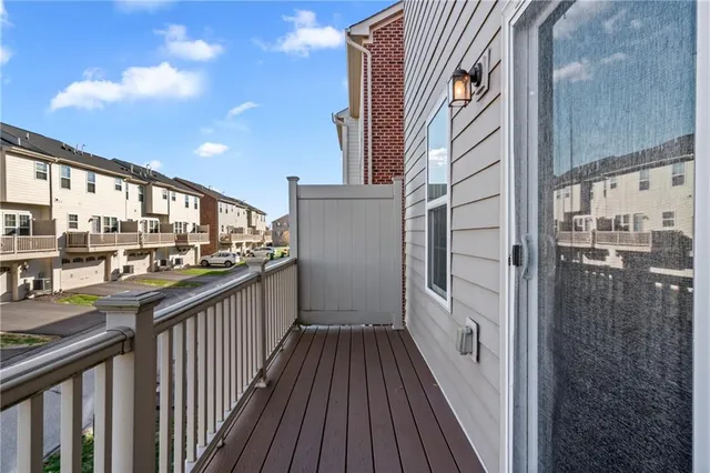 a view of a balcony with wooden floor