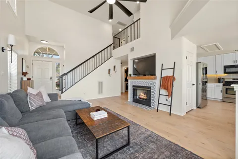 a living room with furniture and a fireplace
