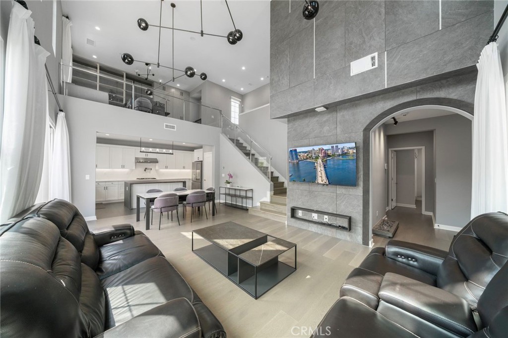 109 Soaring Eagle Irvine, CA 92618 - Photo 1 of 41 a living room with furniture and a chandelier