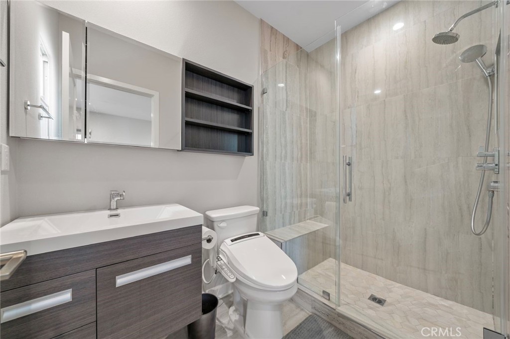 109 Soaring Eagle Irvine, CA 92618 - Photo 23 of 41 a bathroom with a sink a toilet and shower