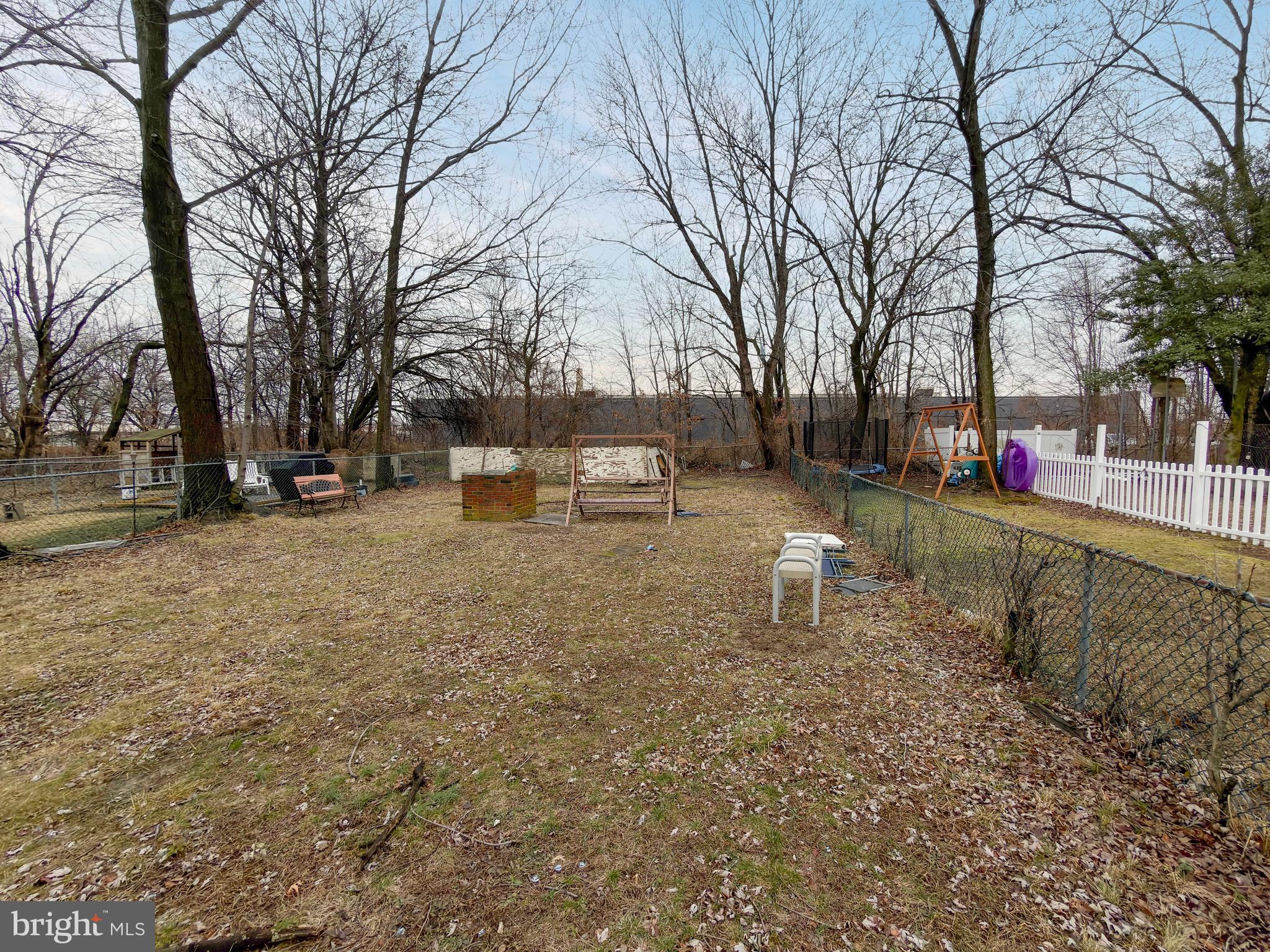 5423 Howland Street Philadelphia, PA 19124 - Photo 3 of 6 a backyard of a house with table and chairs
