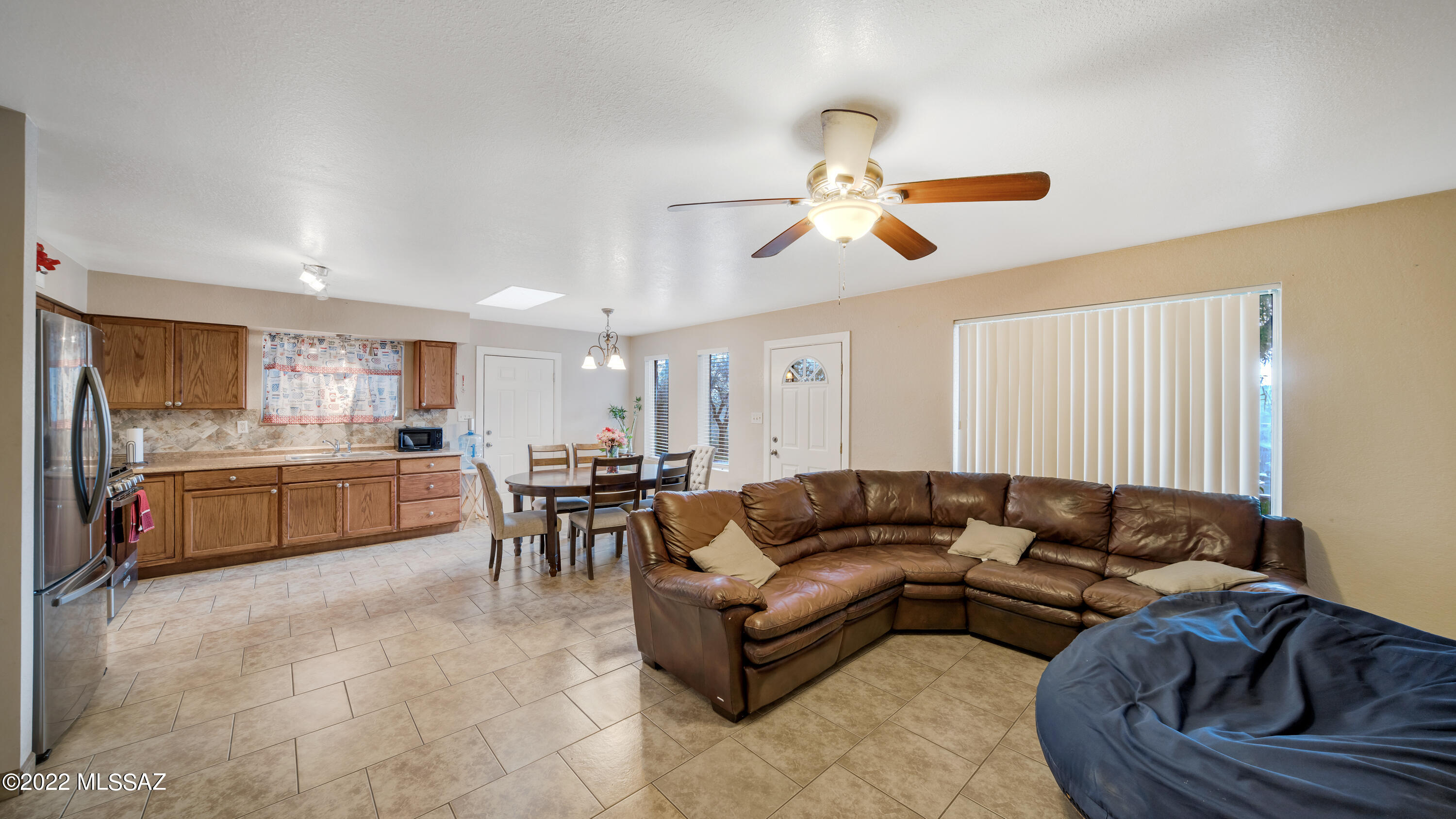 434 Paseo Flamenco Rio Rico, AZ 85648 - Photo 8 of 27 a living room with furniture kitchen view and a chandelier
