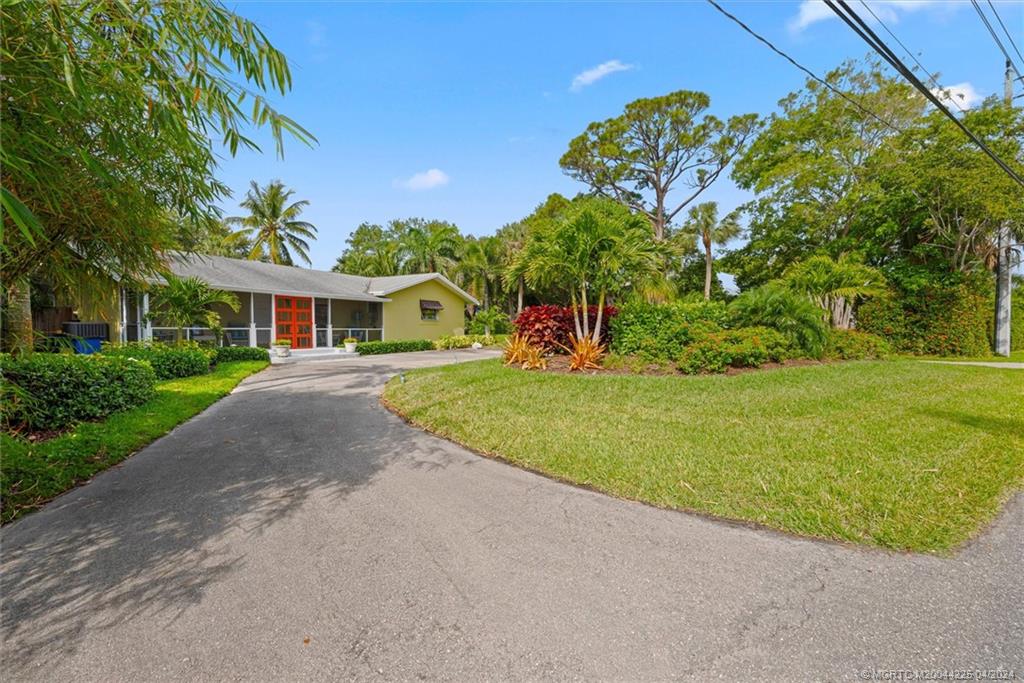 111 South Sewalls Point Road Stuart, FL 34996 - Photo 11 of 60 a view of house with outdoor space and garden