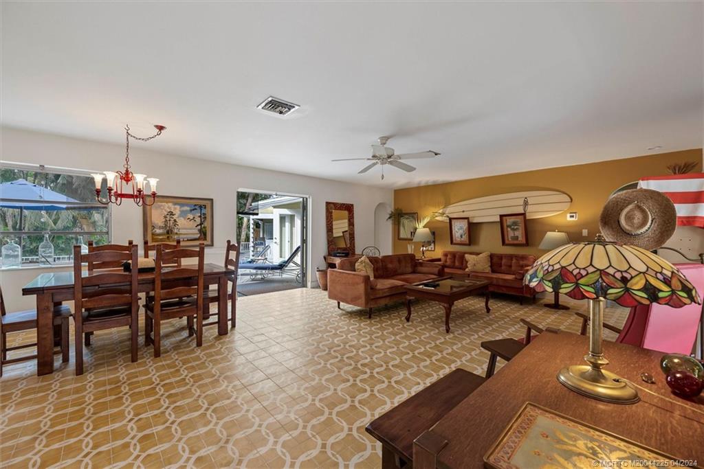 111 South Sewalls Point Road Stuart, FL 34996 - Photo 17 of 60 a living room with couches and kitchen view with wooden floor