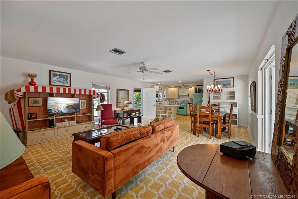 111 South Sewalls Point Road Stuart, FL 34996 - Photo 21 of 60 a living room with furniture and a flat screen tv