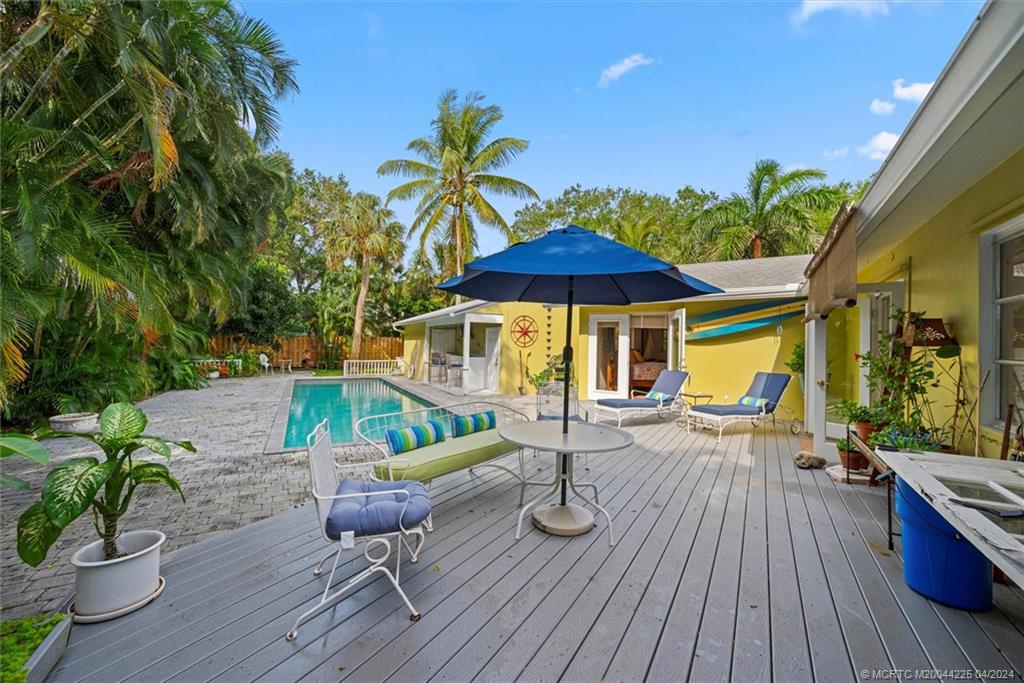 111 South Sewalls Point Road Stuart, FL 34996 - Photo 44 of 60 an outdoor space with furniture and umbrella