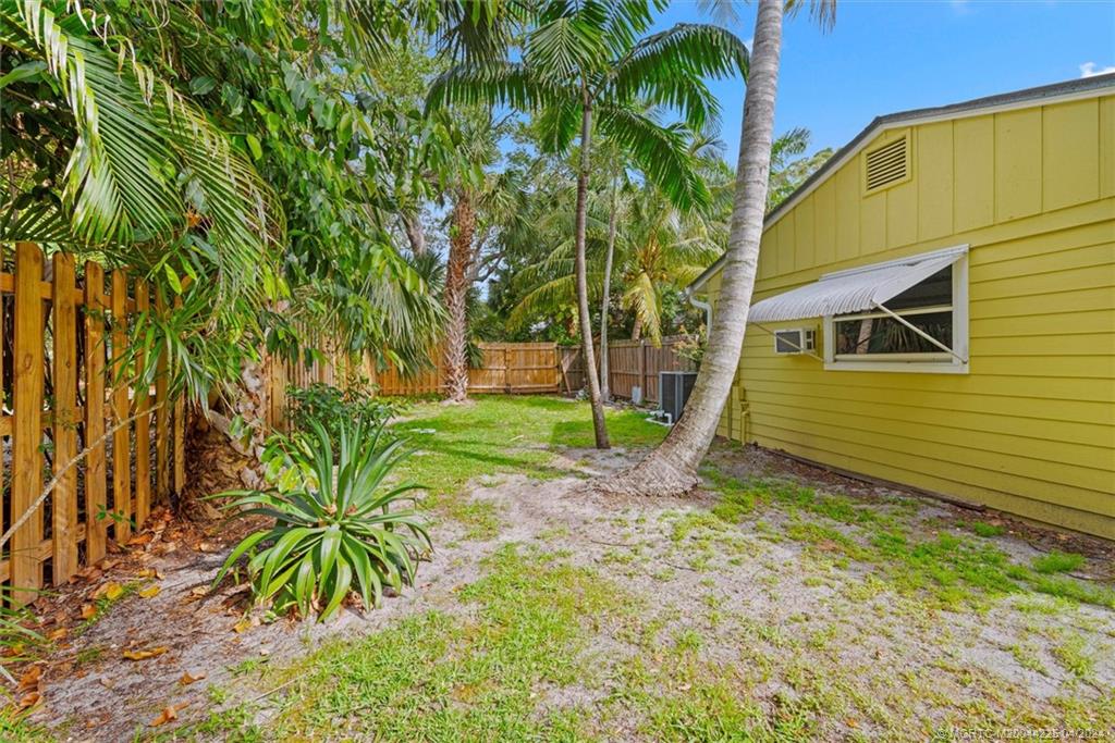 111 South Sewalls Point Road Stuart, FL 34996 - Photo 49 of 60 a view of a house with a yard