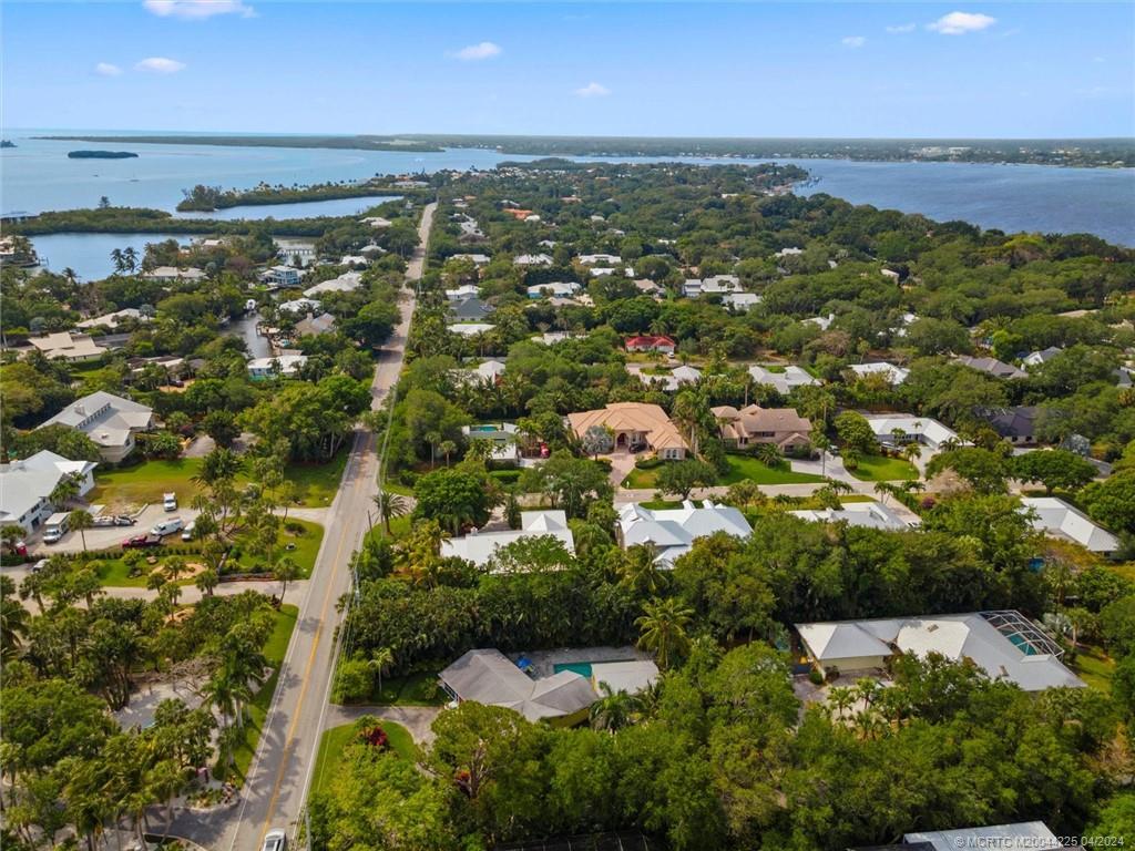 111 South Sewalls Point Road Stuart, FL 34996 - Photo 60 of 60 an aerial view of residential houses with outdoor space and trees