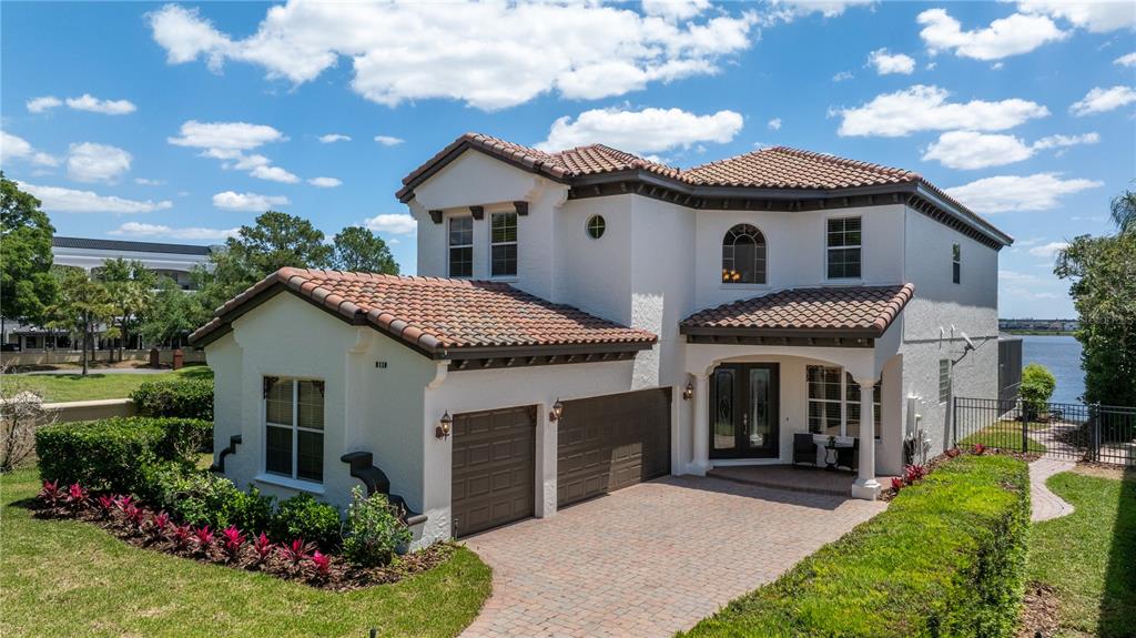8119 Vía Rosa Orlando, FL 32836 - Photo 2 of 62 a front view of a house with a garden