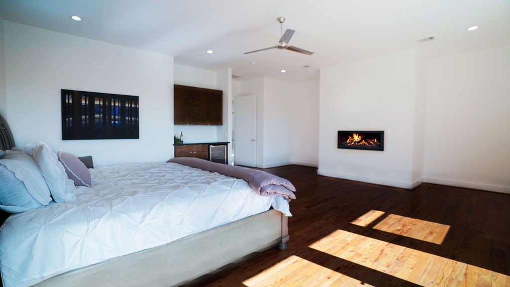 3308 North MacGregor Way Houston, TX 77004 - Photo 31 of 46 Primary Bedroom with fireplace