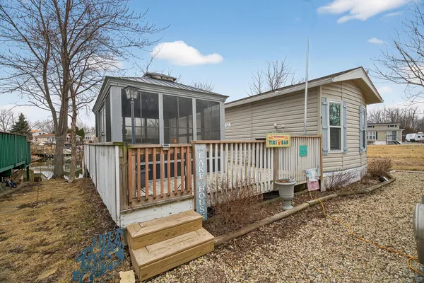 a front view of a house with wooden fence