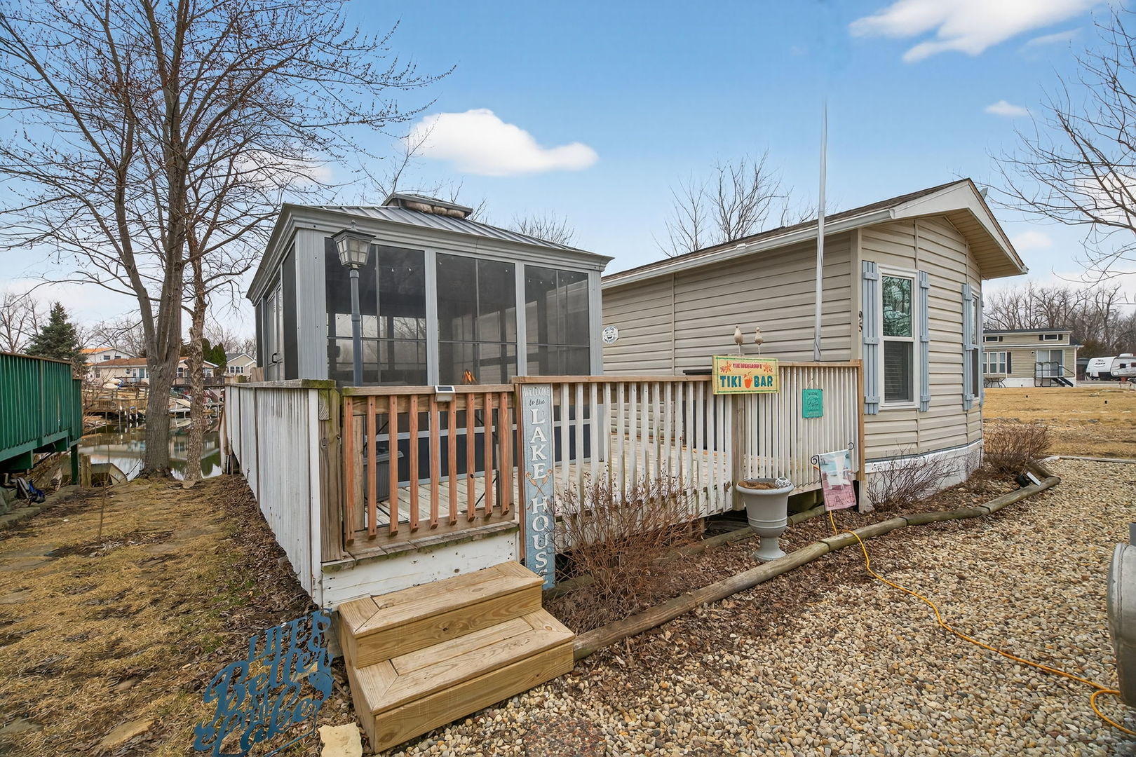 95 Dinosaur Road Wilmington, IL 60481 - Photo 1 of 54 a front view of a house with wooden fence