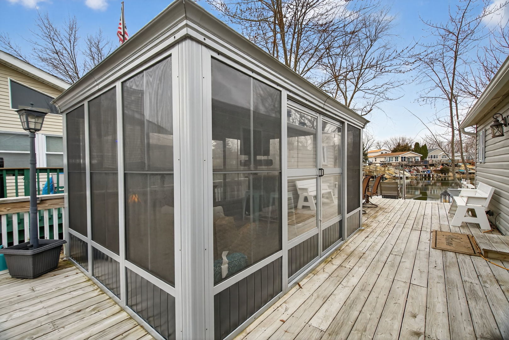 95 Dinosaur Road Wilmington, IL 60481 - Photo 15 of 54 a view of a balcony with wooden floor and floor to ceiling window