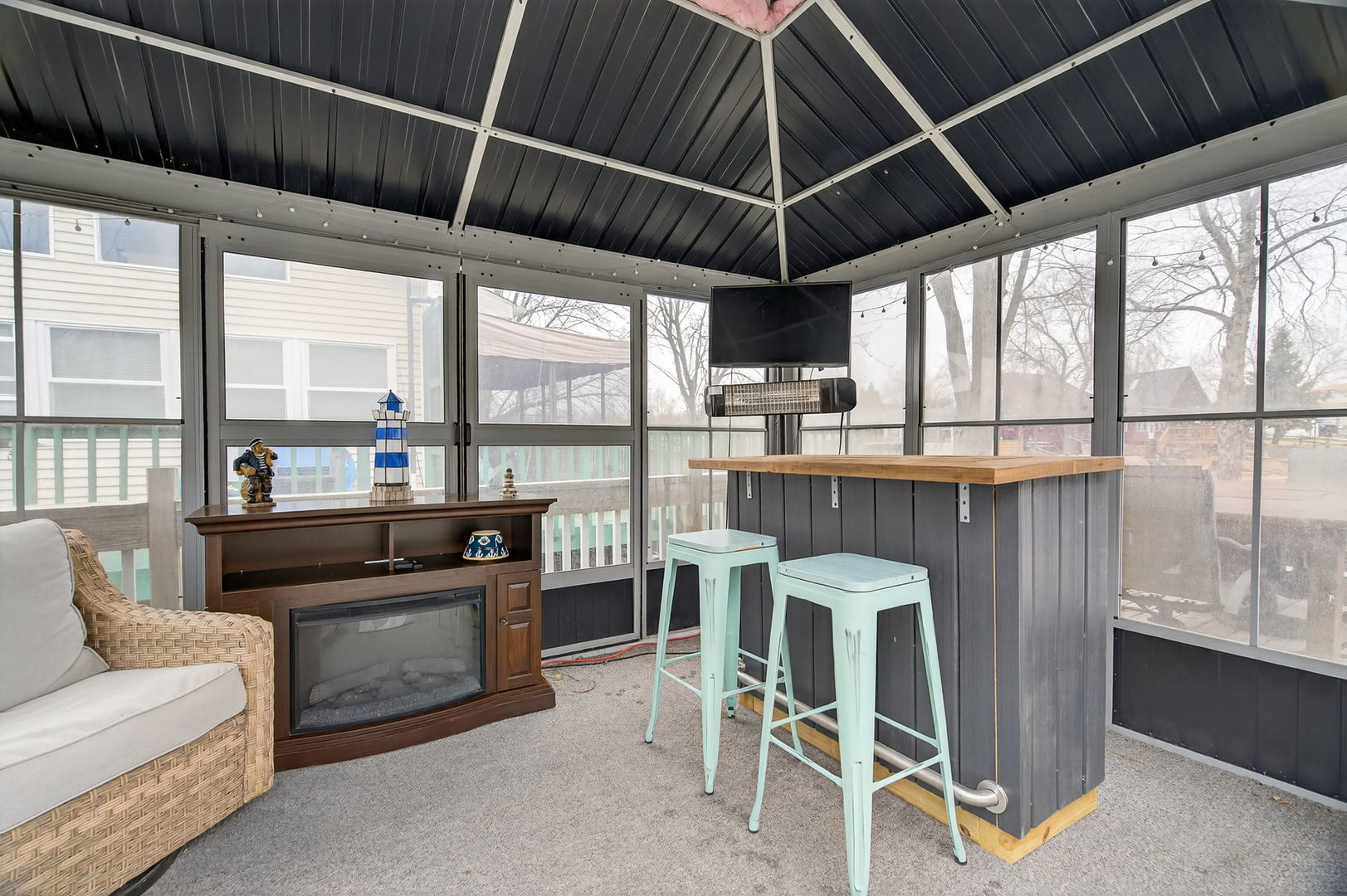 95 Dinosaur Road Wilmington, IL 60481 - Photo 16 of 54 a kitchen with stainless steel appliances granite countertop a stove a refrigerator a dining table and chairs with a floor to ceiling window