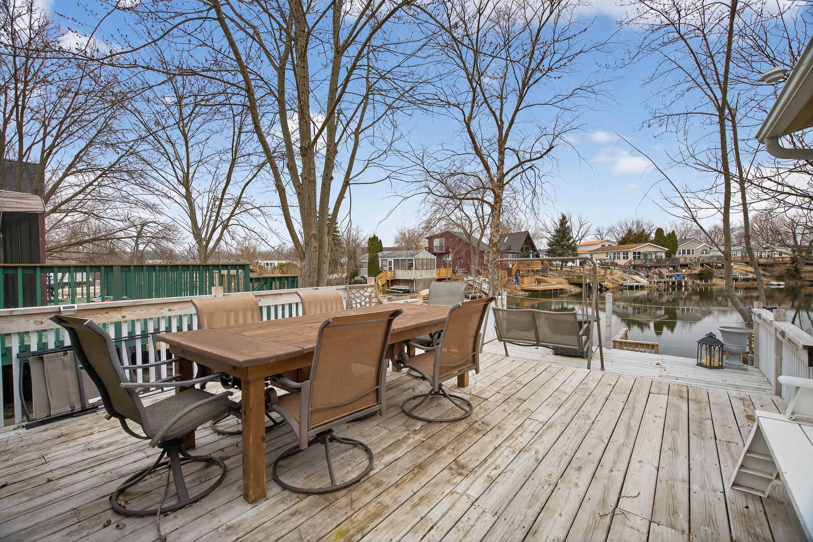 95 Dinosaur Road Wilmington, IL 60481 - Photo 20 of 54 a view of a roof deck with table and chairs and wooden floor