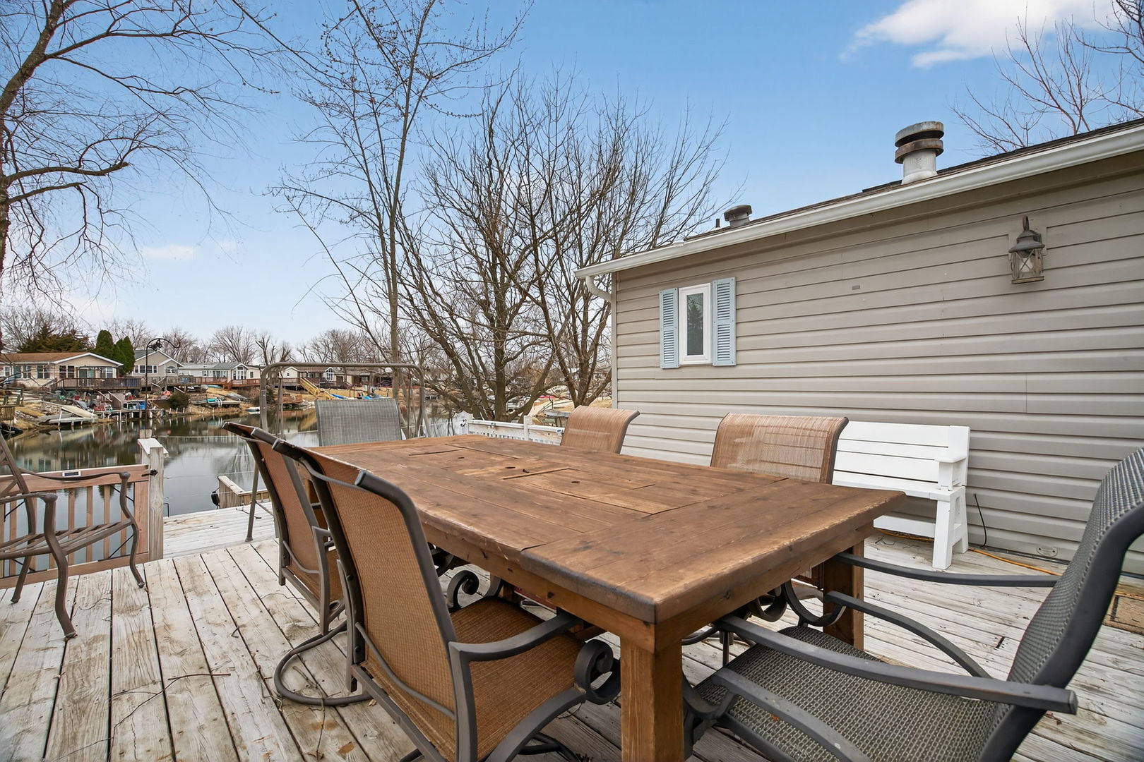 95 Dinosaur Road Wilmington, IL 60481 - Photo 21 of 54 a view of a patio with table and chairs with wooden floor and fence