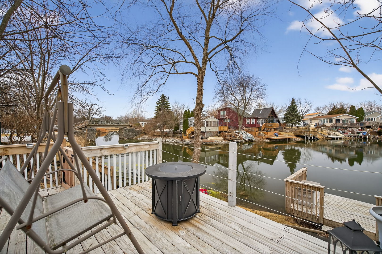 95 Dinosaur Road Wilmington, IL 60481 - Photo 22 of 54 a view of a balcony with wooden floor and lake view
