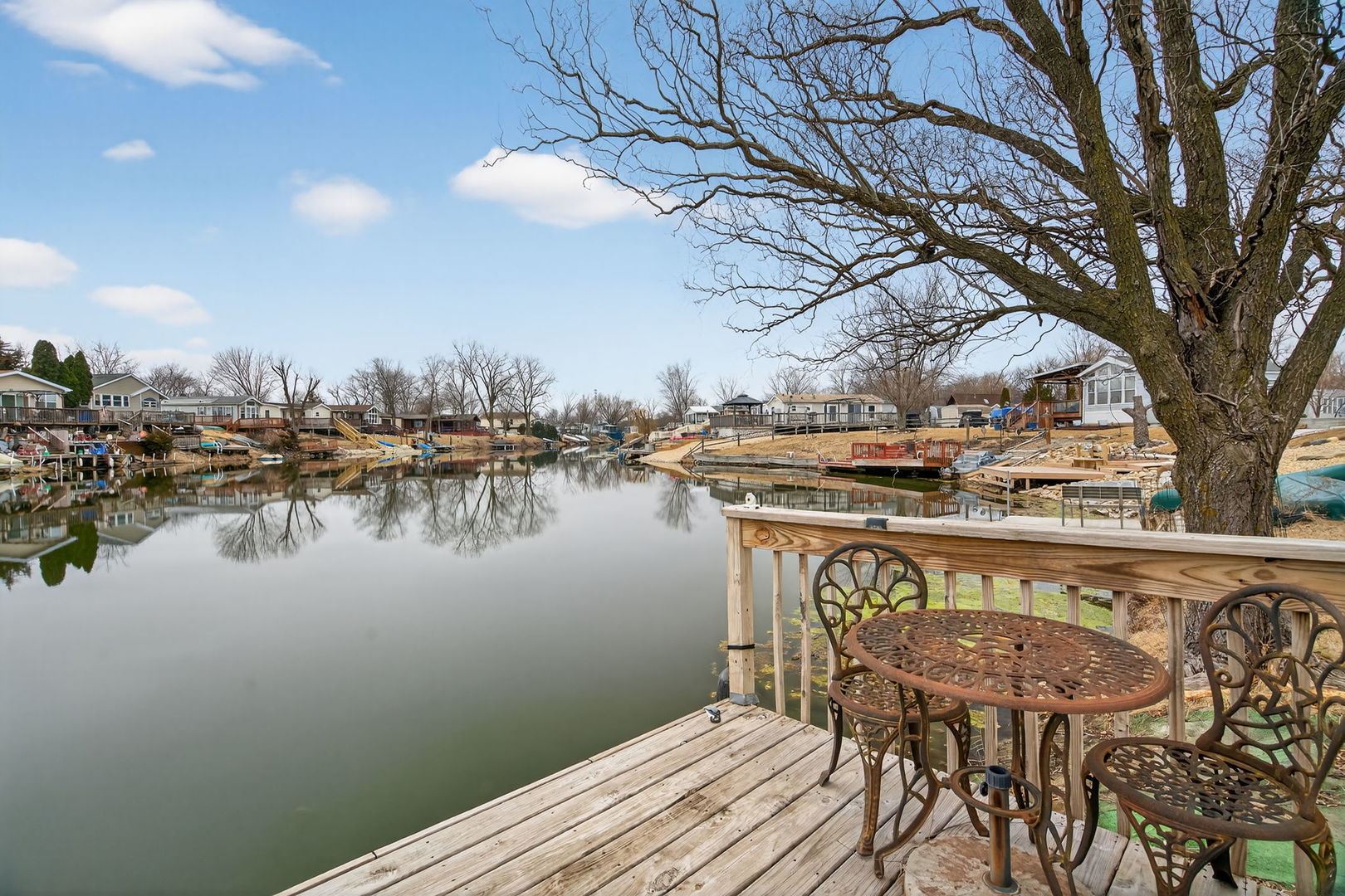 95 Dinosaur Road Wilmington, IL 60481 - Photo 24 of 54 a view of a lake with a table and chairs