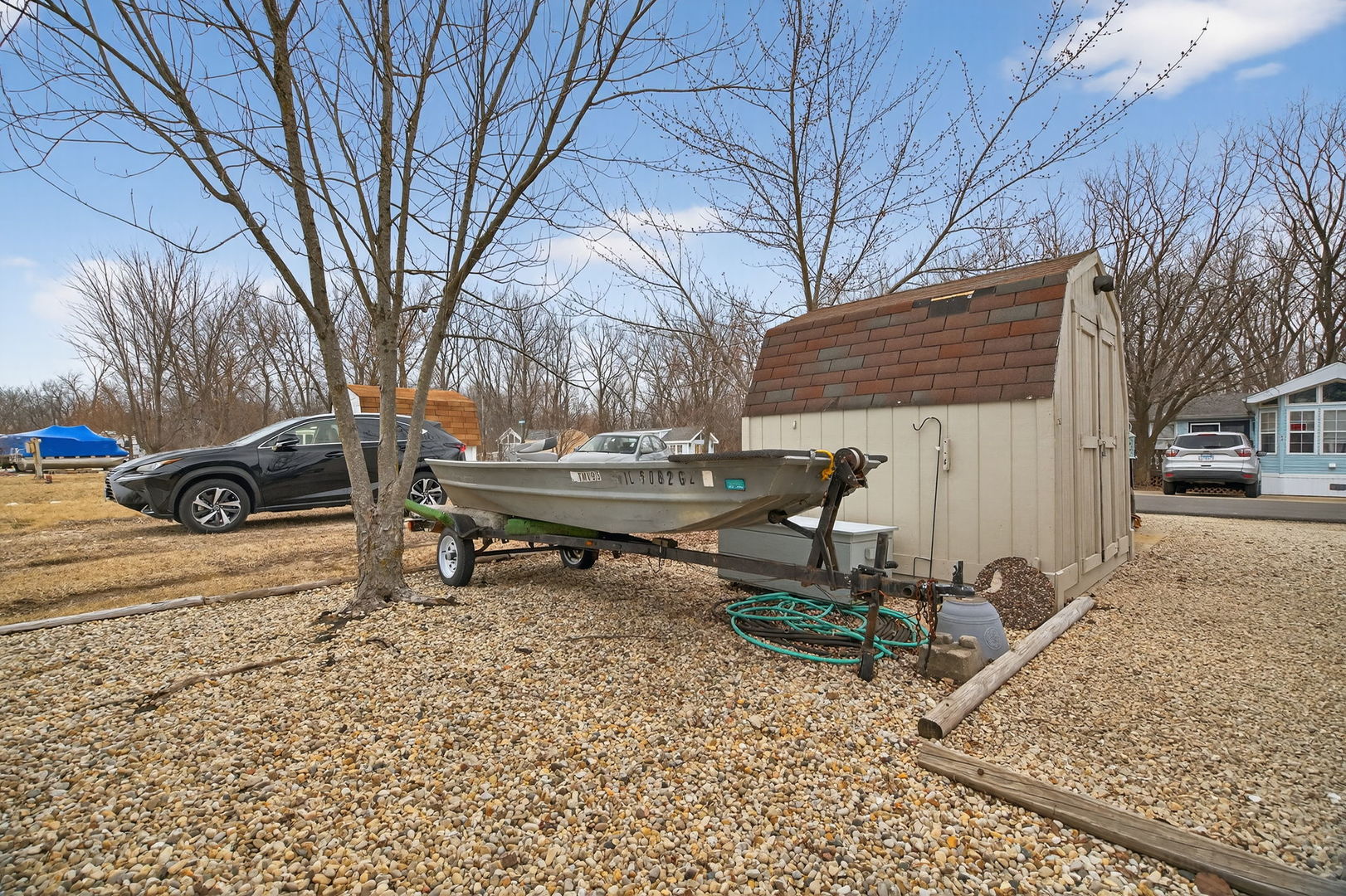 95 Dinosaur Road Wilmington, IL 60481 - Photo 29 of 54 a backyard of a house with table and chairs