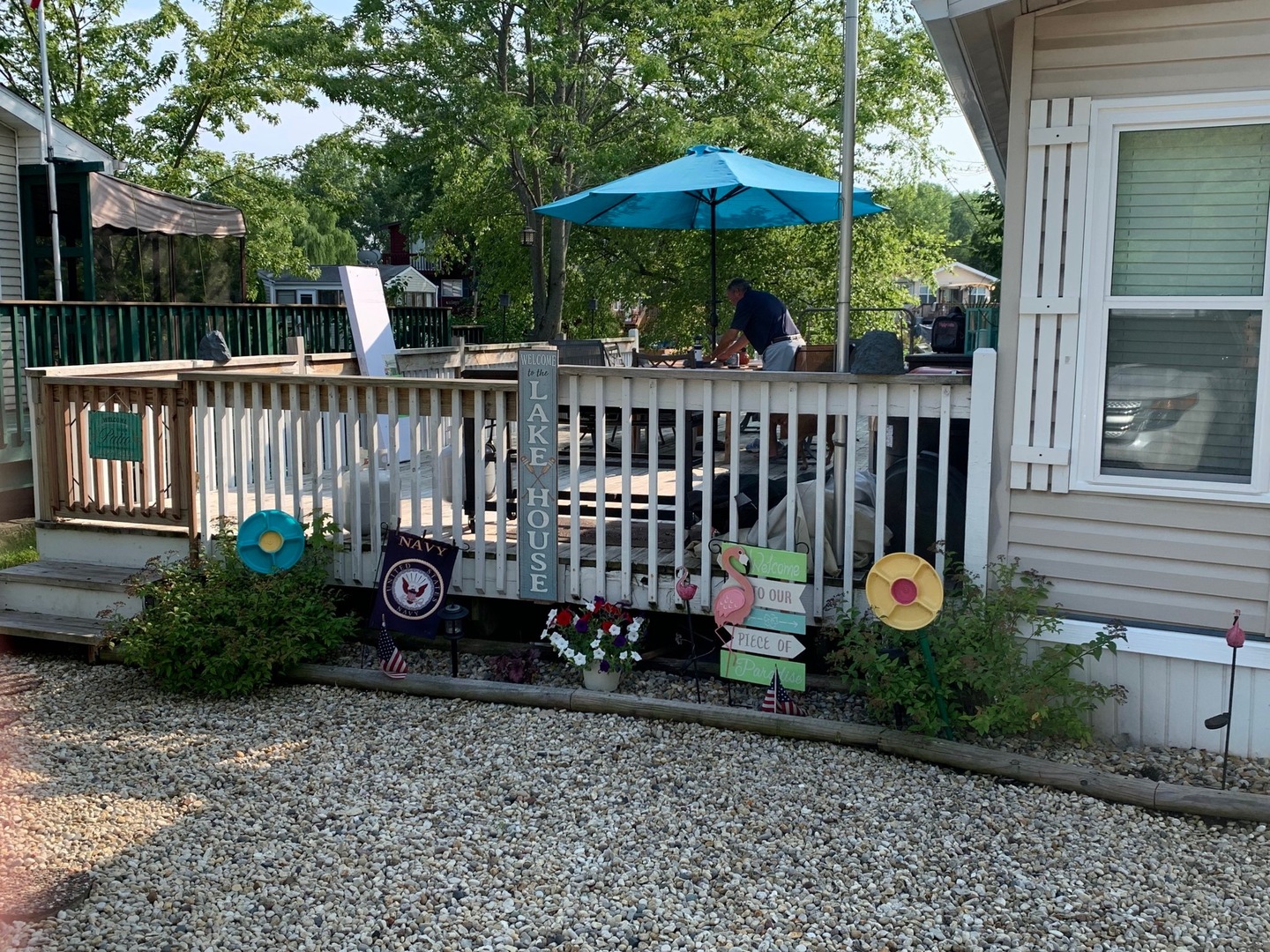95 Dinosaur Road Wilmington, IL 60481 - Photo 35 of 54 a view of a deck with a table and chairs under an umbrella