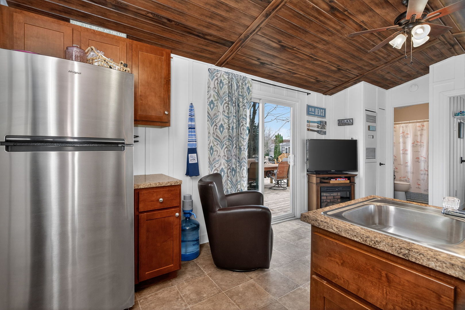95 Dinosaur Road Wilmington, IL 60481 - Photo 7 of 54 a kitchen with stainless steel appliances granite countertop a refrigerator a sink a stove with island
