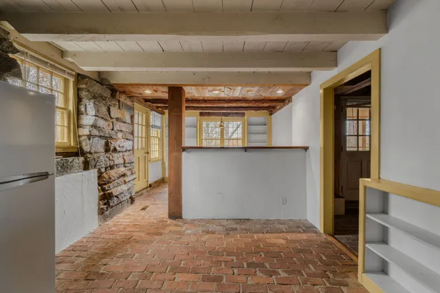 a view of a backyard with wooden fence