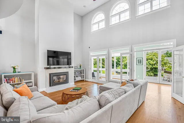 a living room with fireplace furniture and a flat screen tv