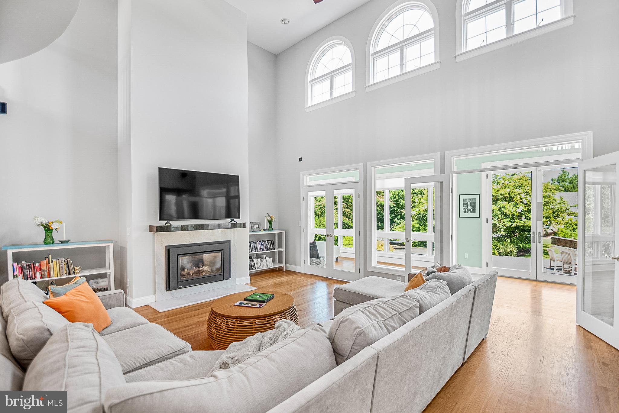 26604 East Bonfield Road Oxford, MD 21654 - Photo 17 of 44 a living room with fireplace furniture and a flat screen tv