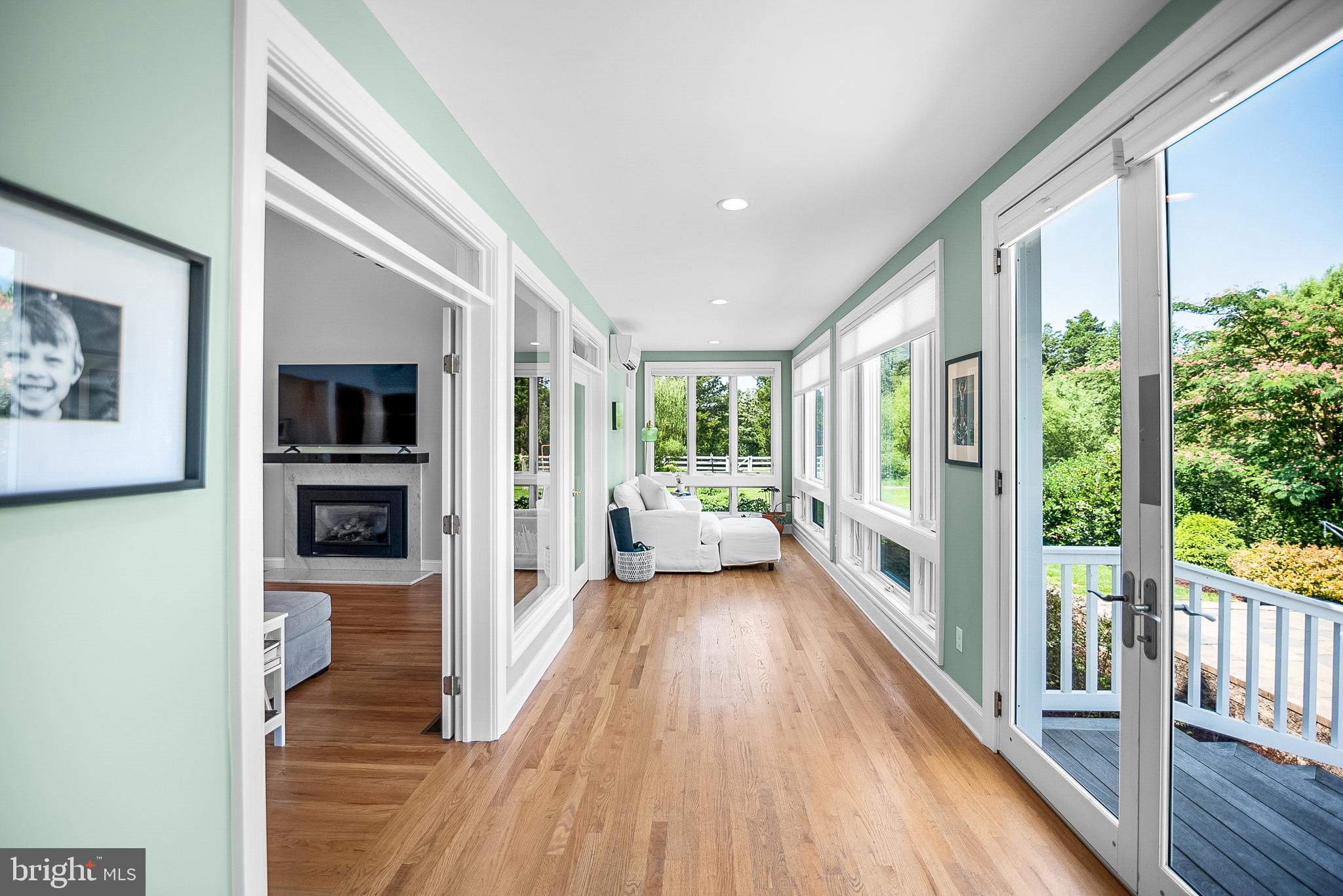 26604 East Bonfield Road Oxford, MD 21654 - Photo 19 of 44 a view of a hallway with wooden floor and a living room