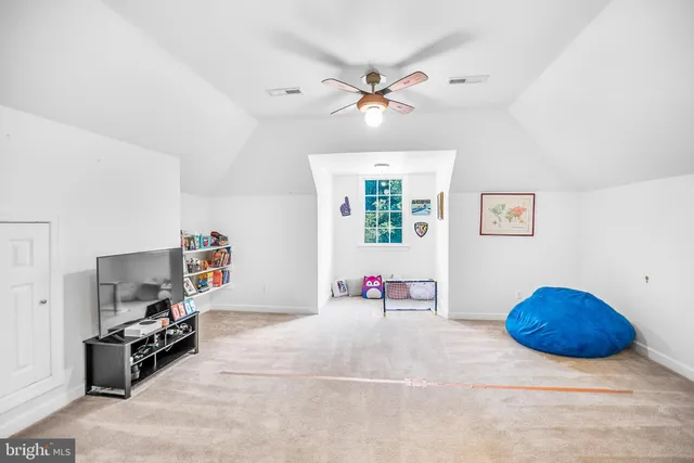 a view of a livingroom with furniture and a flat screen tv