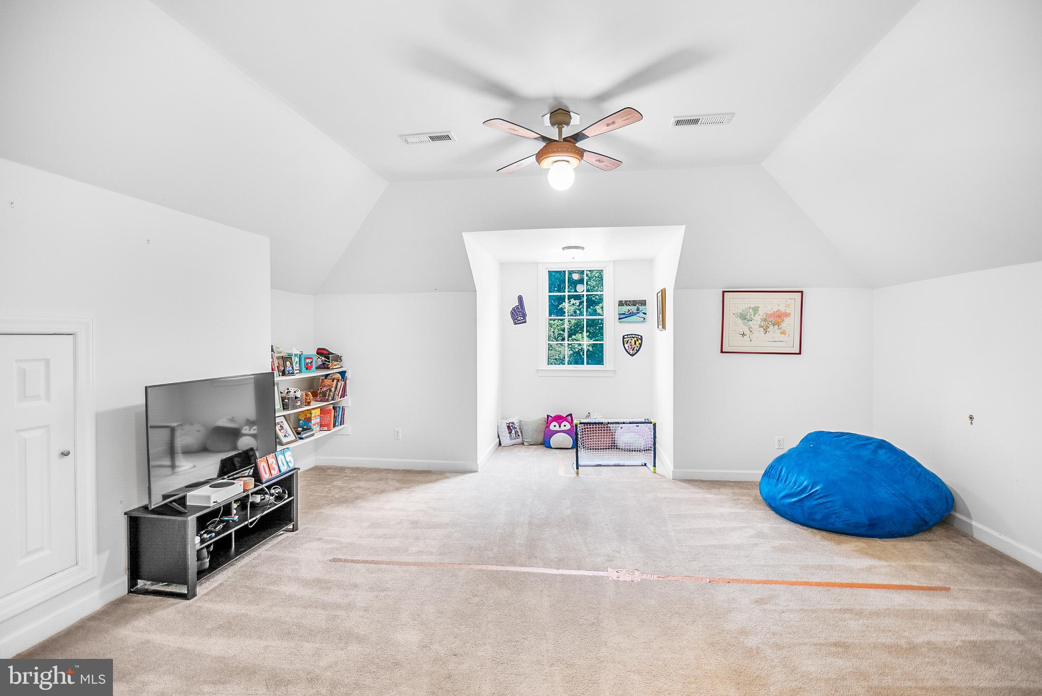 26604 East Bonfield Road Oxford, MD 21654 - Photo 26 of 44 a view of a livingroom with furniture and a flat screen tv