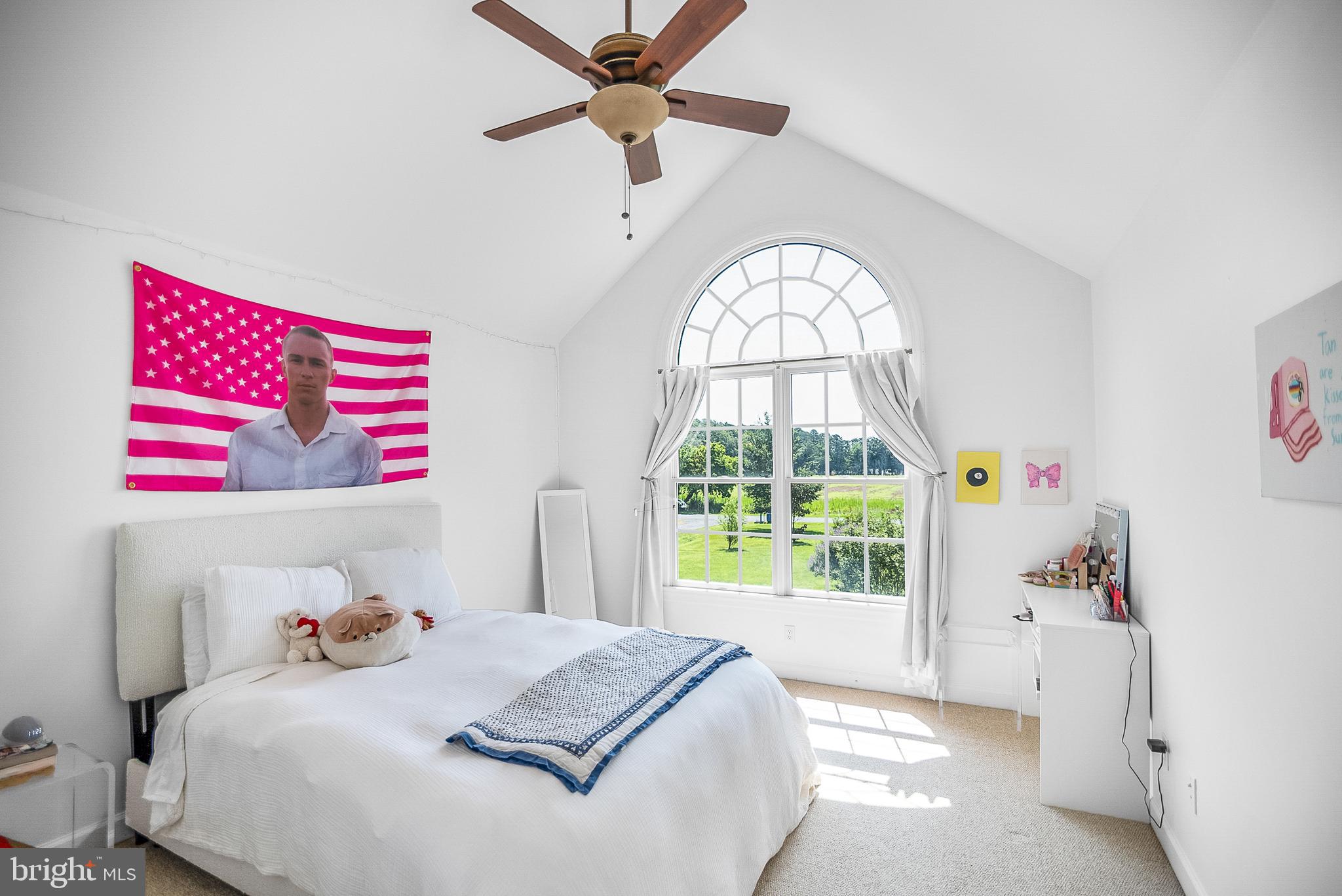 26604 East Bonfield Road Oxford, MD 21654 - Photo 27 of 44 a bedroom with a bed and a large window