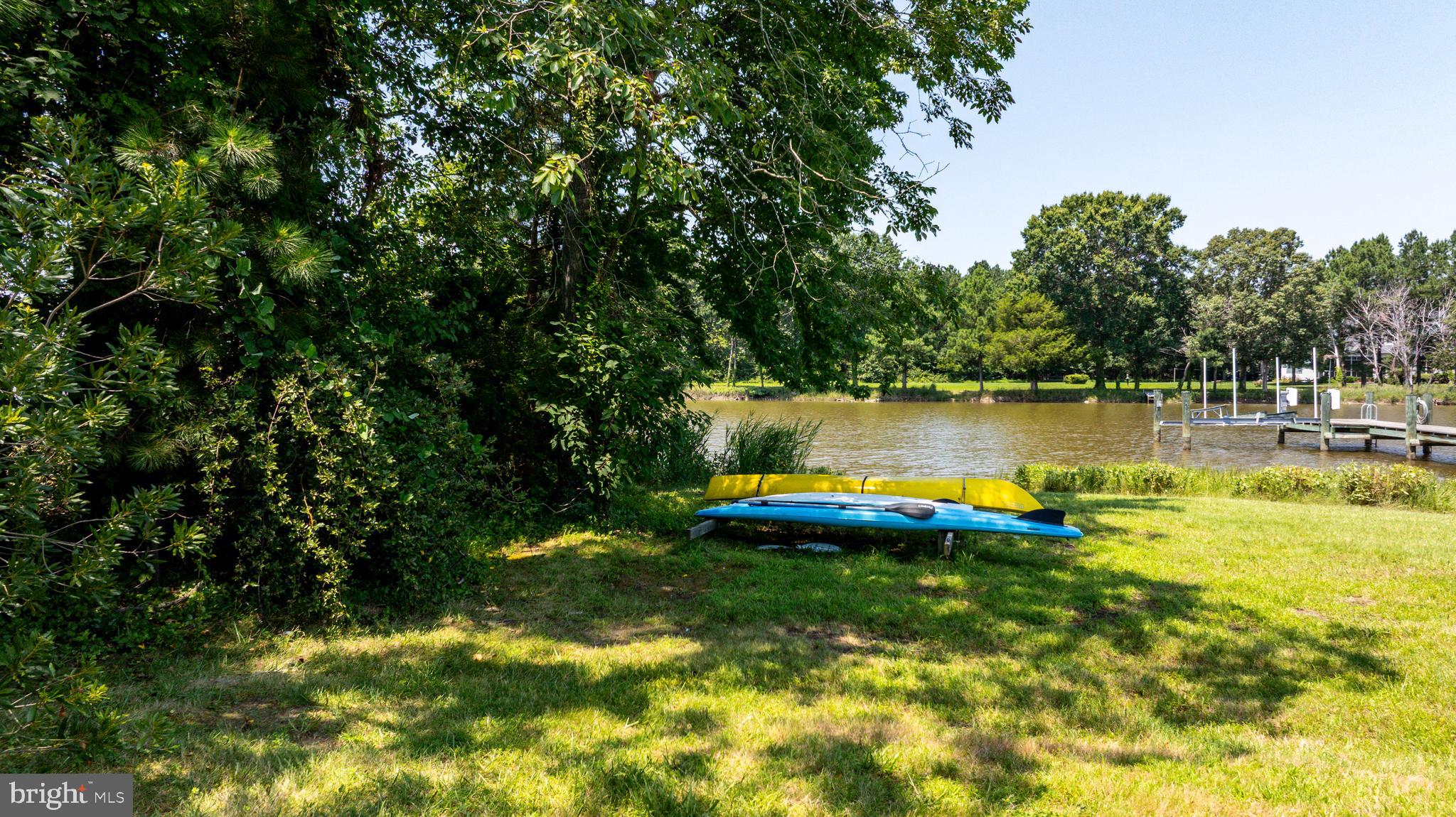 26604 East Bonfield Road Oxford, MD 21654 - Photo 30 of 44 a view of a lake with houses in the back