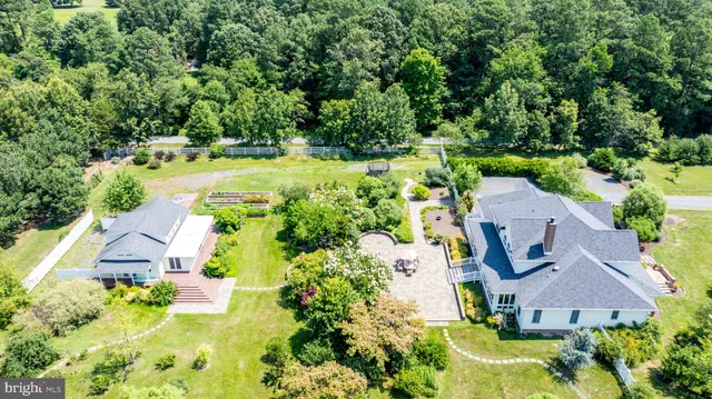 an aerial view of a house with a garden