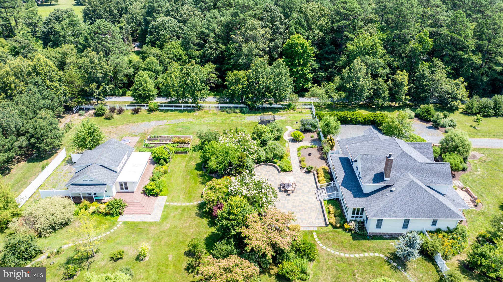 26604 East Bonfield Road Oxford, MD 21654 - Photo 38 of 44 an aerial view of a house with a garden