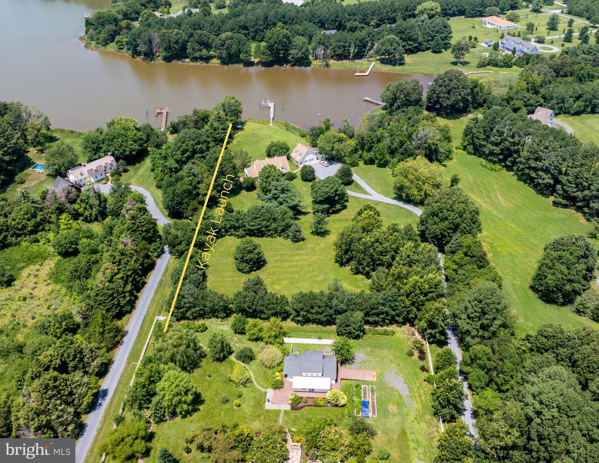 26604 East Bonfield Road Oxford, MD 21654 - Photo 44 of 44 an aerial view of a house with a yard and lake view