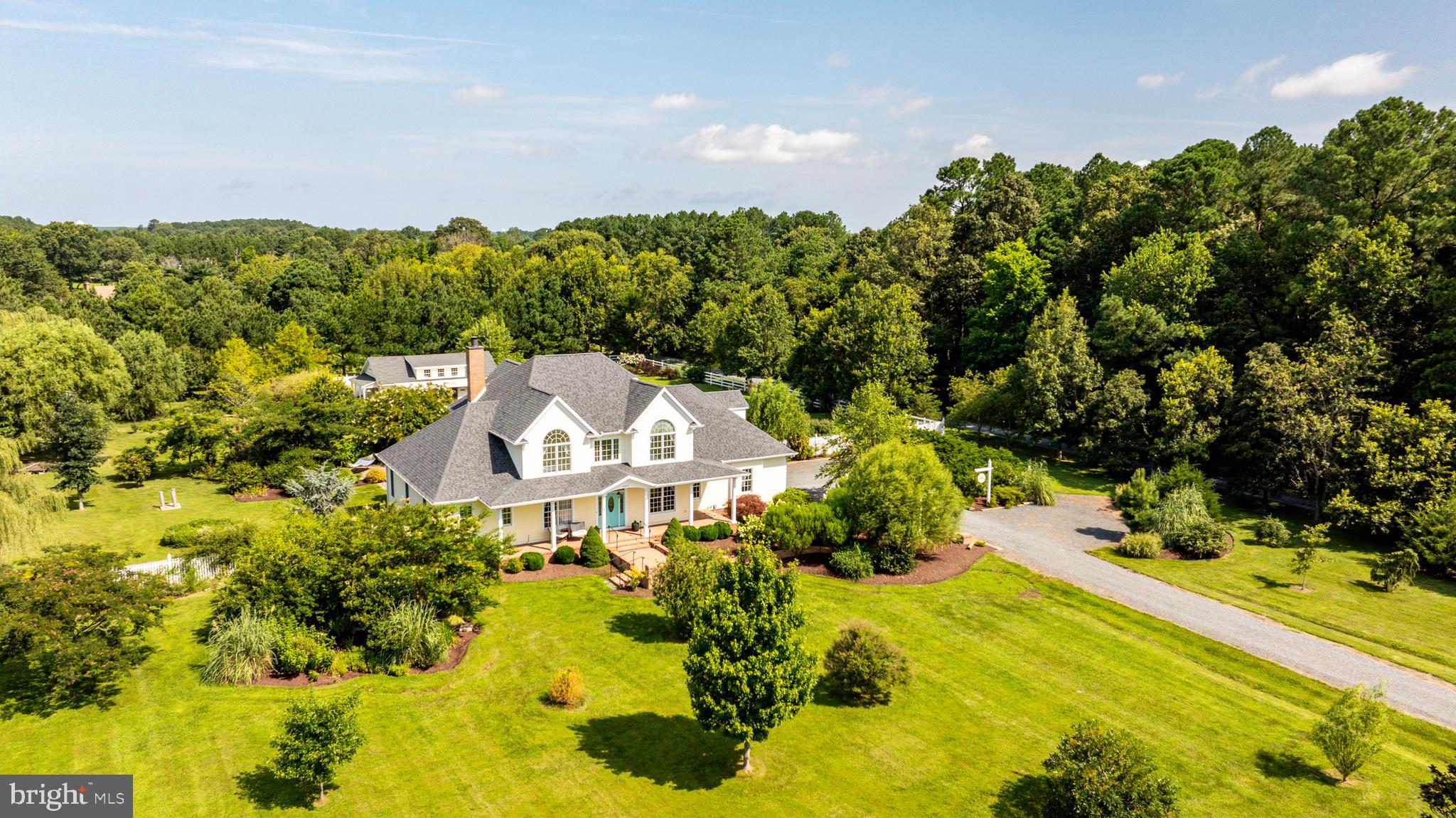 26604 East Bonfield Road Oxford, MD 21654 - Photo 6 of 44 a view of a house with a yard and sitting area