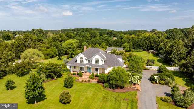 a view of a city with flower garden and wooden fence