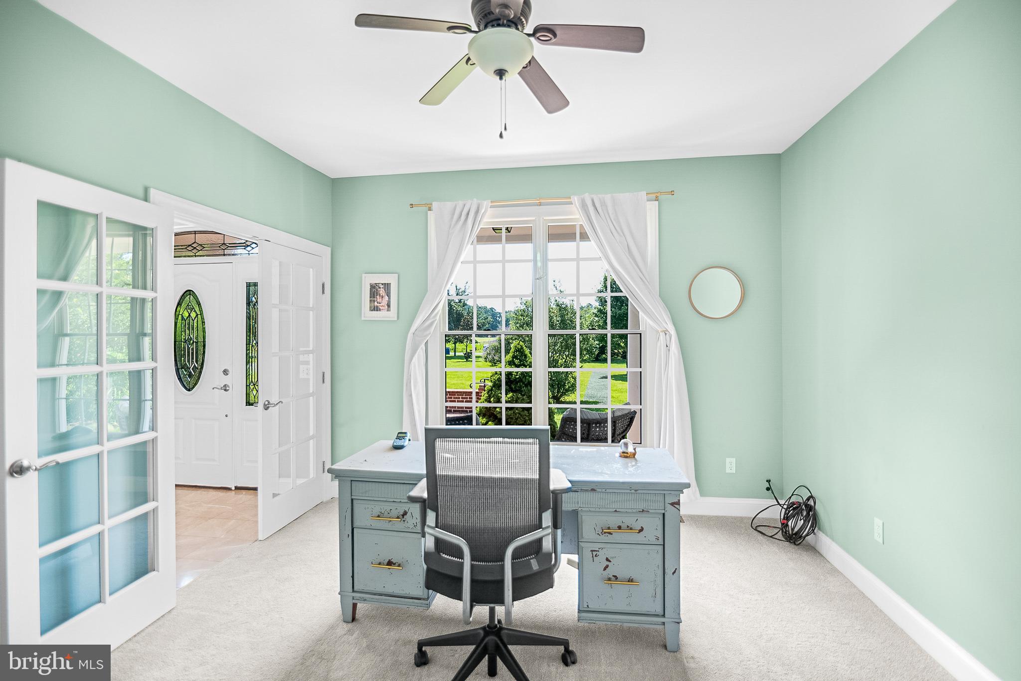 26604 East Bonfield Road Oxford, MD 21654 - Photo 10 of 44 a view of a workspace with furniture and a window