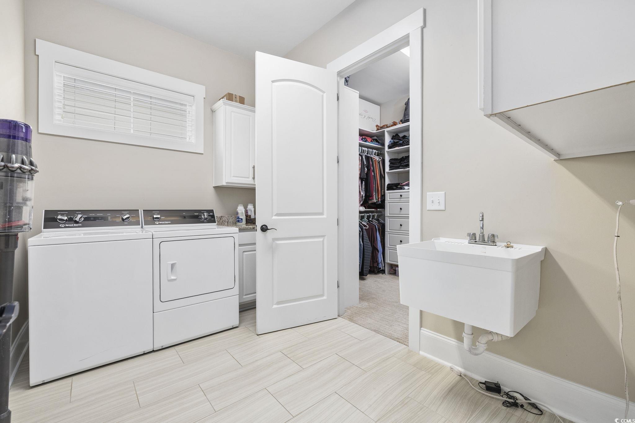 636 North Creekside Drive Murrells Inlet, SC 29576 - Photo 16 of 40 Laundry room featuring cabinet space and washer and dryer
