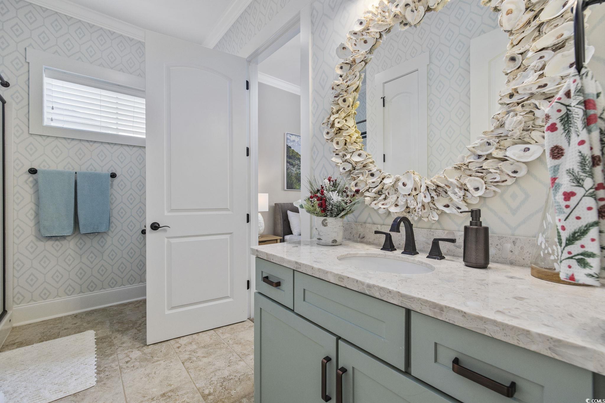 636 North Creekside Drive Murrells Inlet, SC 29576 - Photo 18 of 40 Full bath featuring wallpapered walls, ornamental molding, vanity, and a shower stall