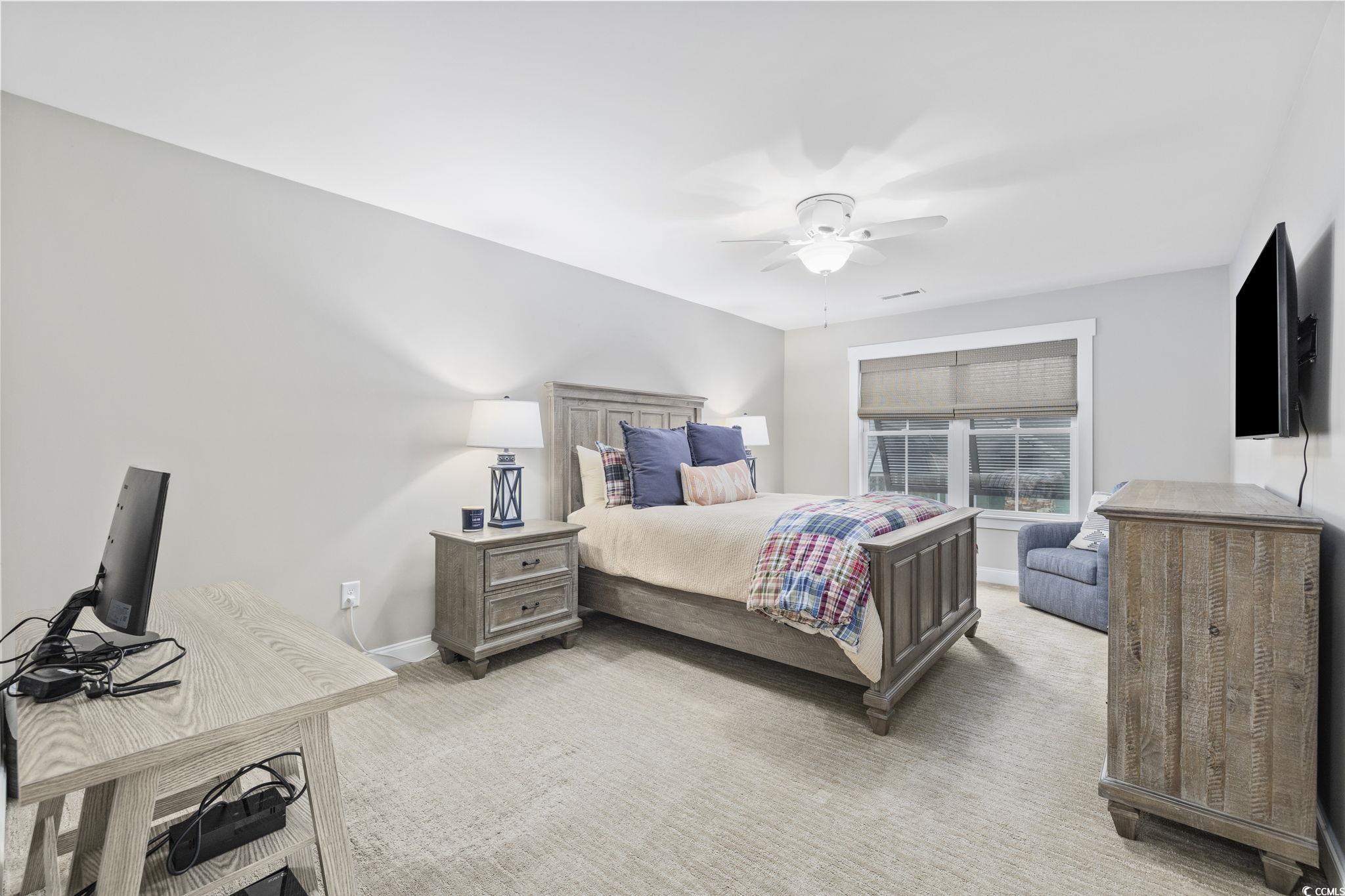 636 North Creekside Drive Murrells Inlet, SC 29576 - Photo 24 of 40 Bedroom with light carpet and ceiling fan