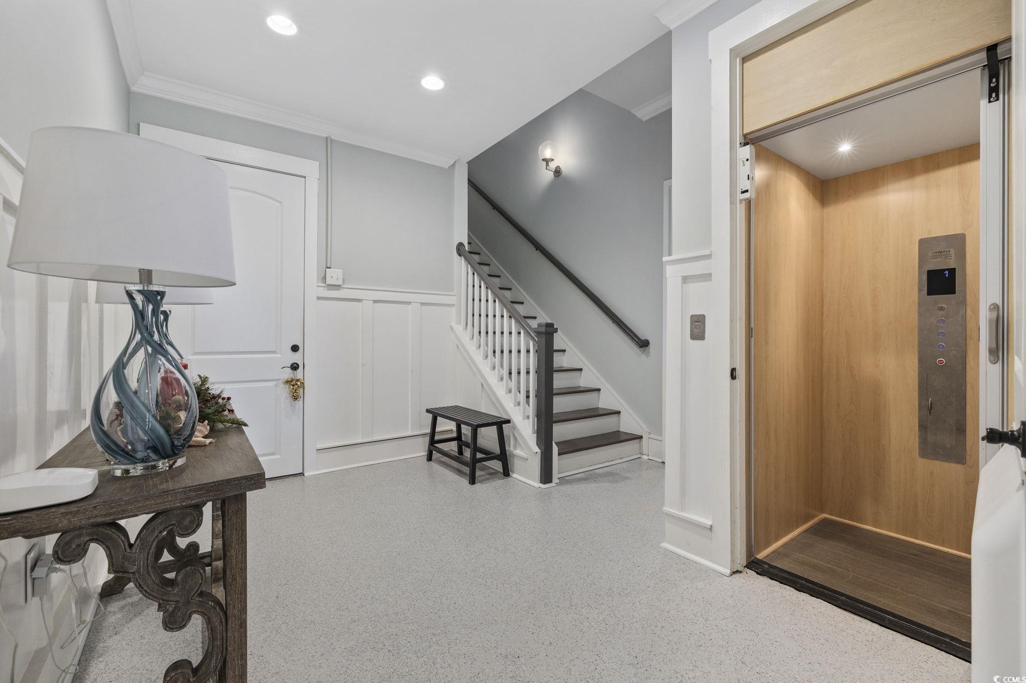 636 North Creekside Drive Murrells Inlet, SC 29576 - Photo 29 of 40 Entrance foyer with stairs, elevator, ornamental molding, a decorative wall, and recessed lighting
