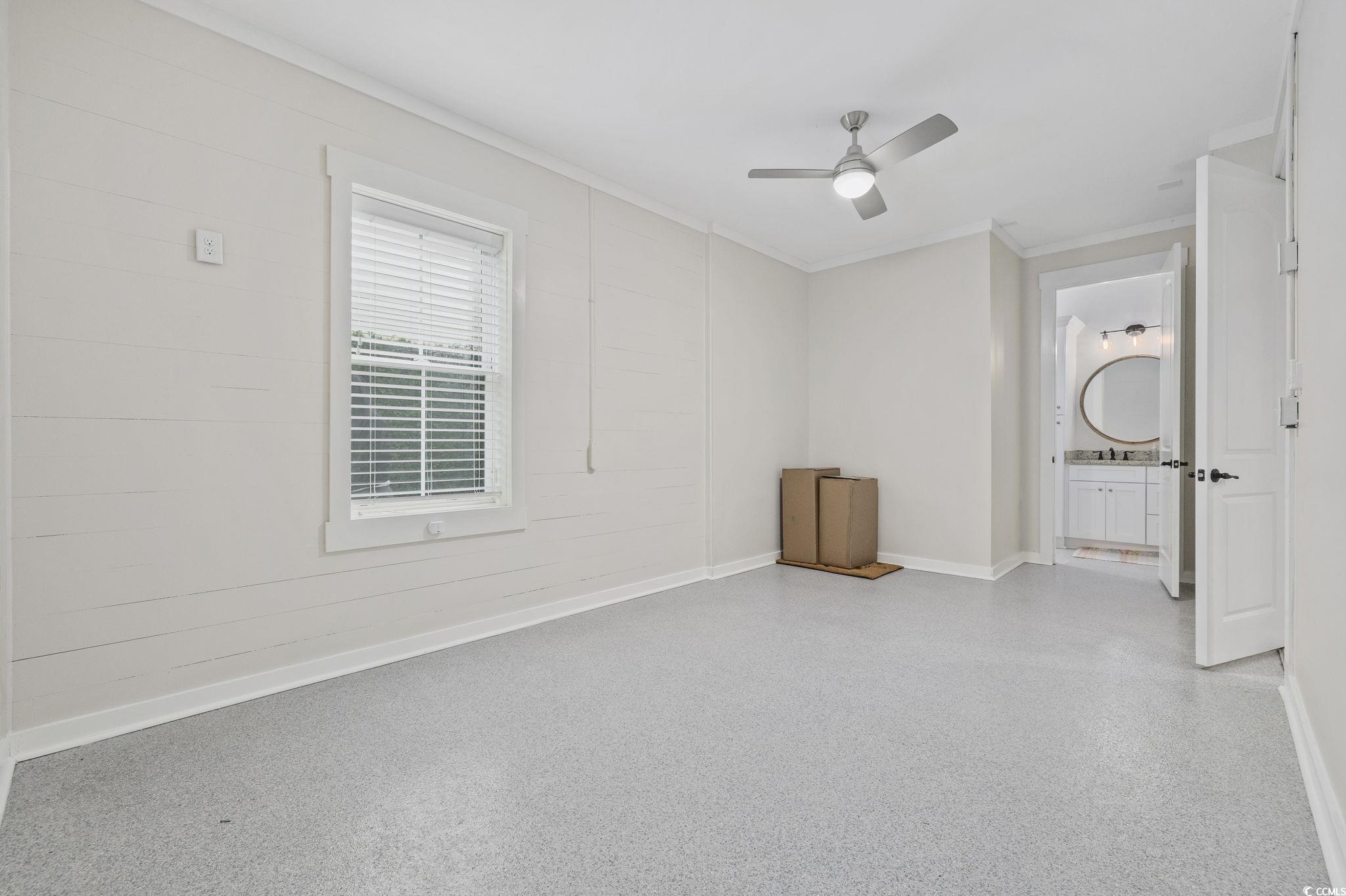 636 North Creekside Drive Murrells Inlet, SC 29576 - Photo 33 of 40 Empty room with crown molding and a ceiling fan