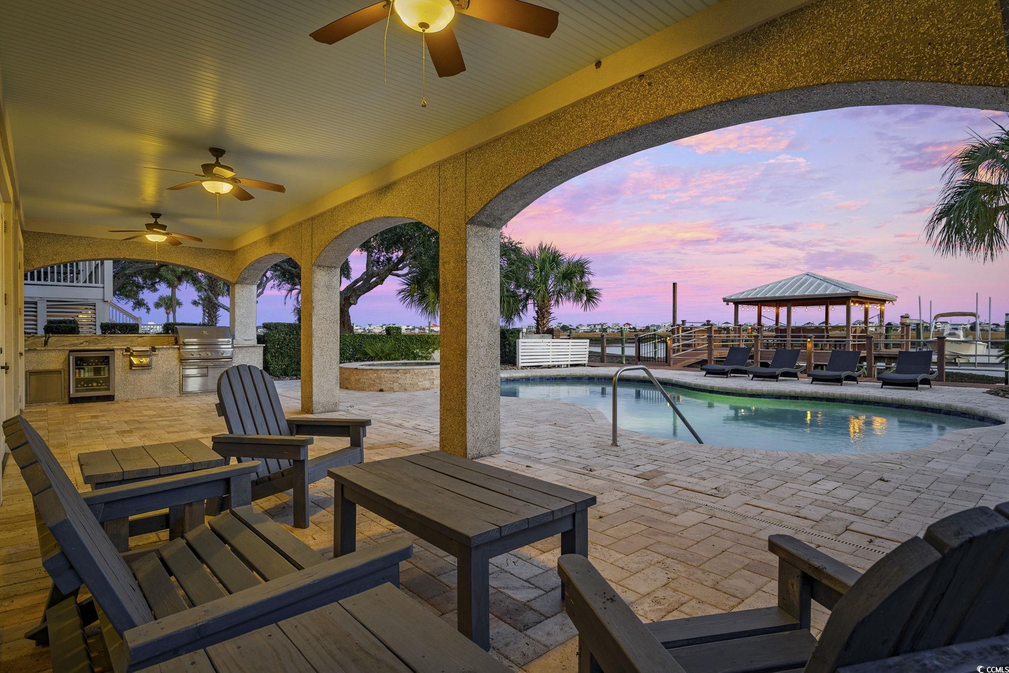 636 North Creekside Drive Murrells Inlet, SC 29576 - Photo 35 of 40 Outdoor pool with a patio area and area for grilling